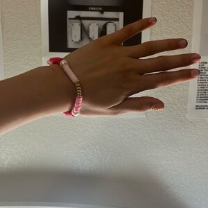 A bracelet with gold rings and different shades of pink!💖
